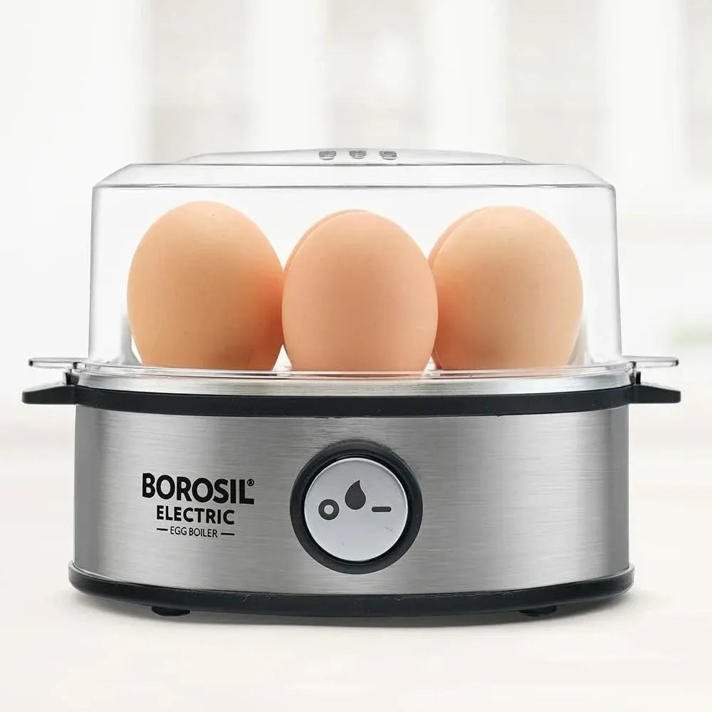 Modern electric egg boiler steaming multiple eggs automatically on kitchen counter.