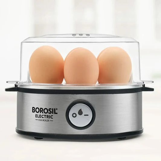 Modern electric egg boiler steaming multiple eggs automatically on kitchen counter.