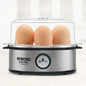 Modern electric egg boiler steaming multiple eggs automatically on kitchen counter.