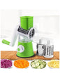 Manual drum vegetable cutter slicer with suction base and multiple blades.
